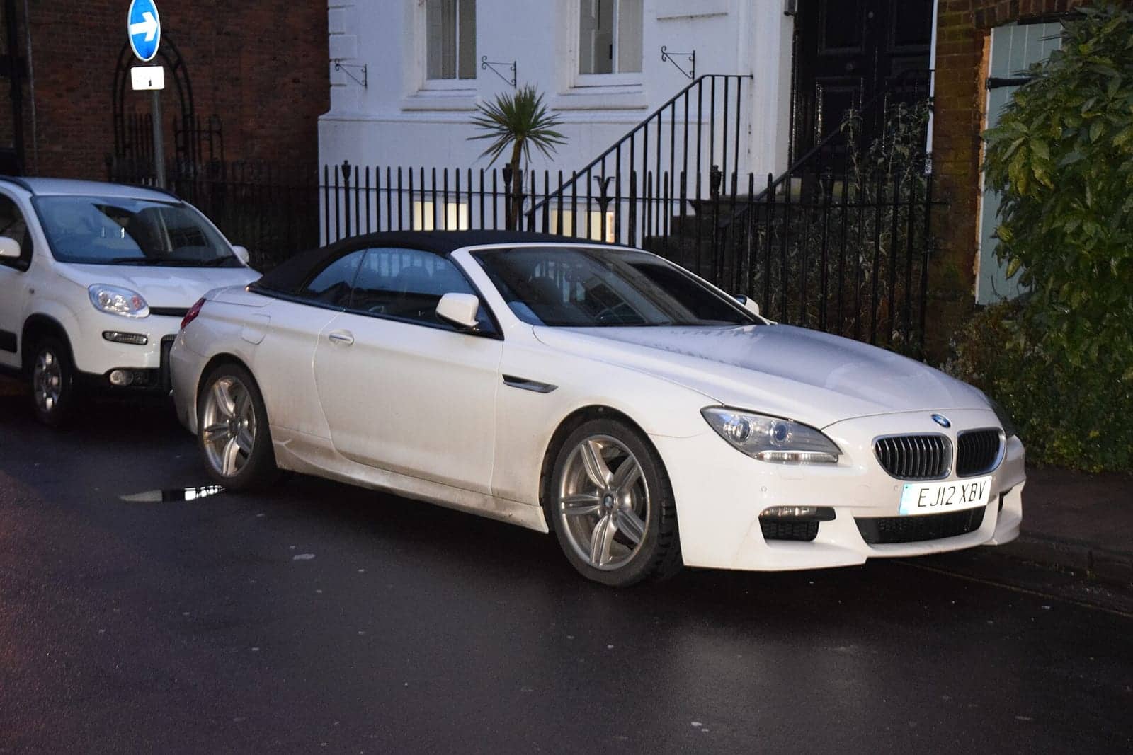 White BMW 640d convertible with the top down, front three-quarter view