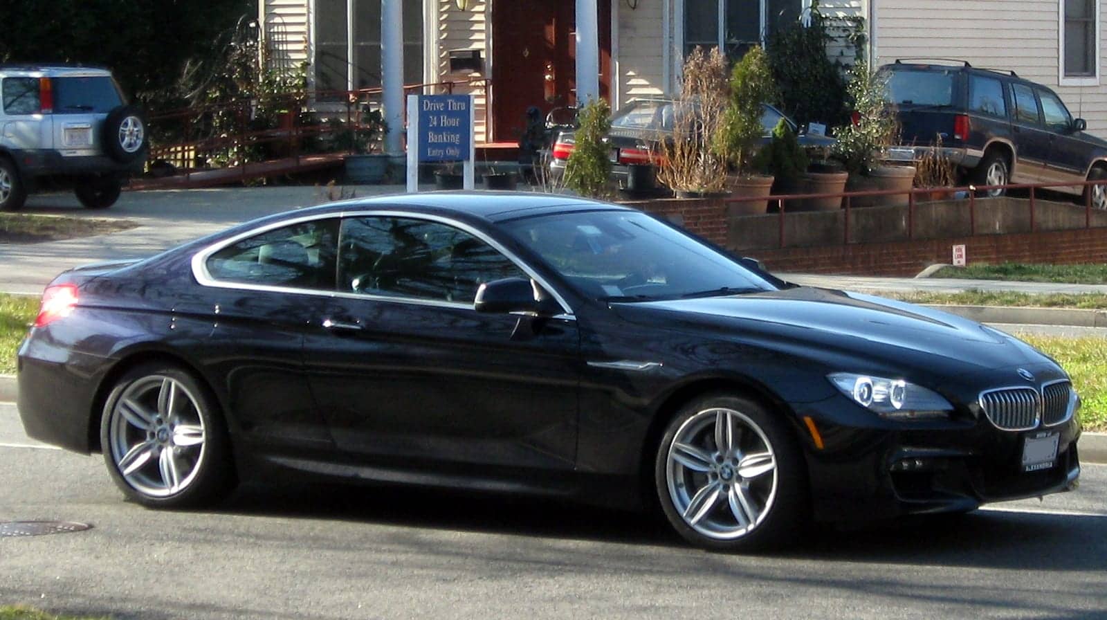 Black BMW 650i coupé, side view