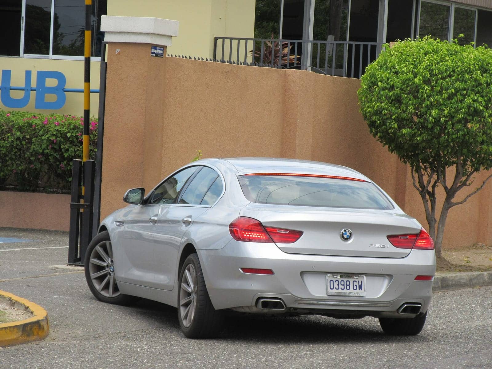 Silver BMW 650i Gran Coupé, rear three-quarter view