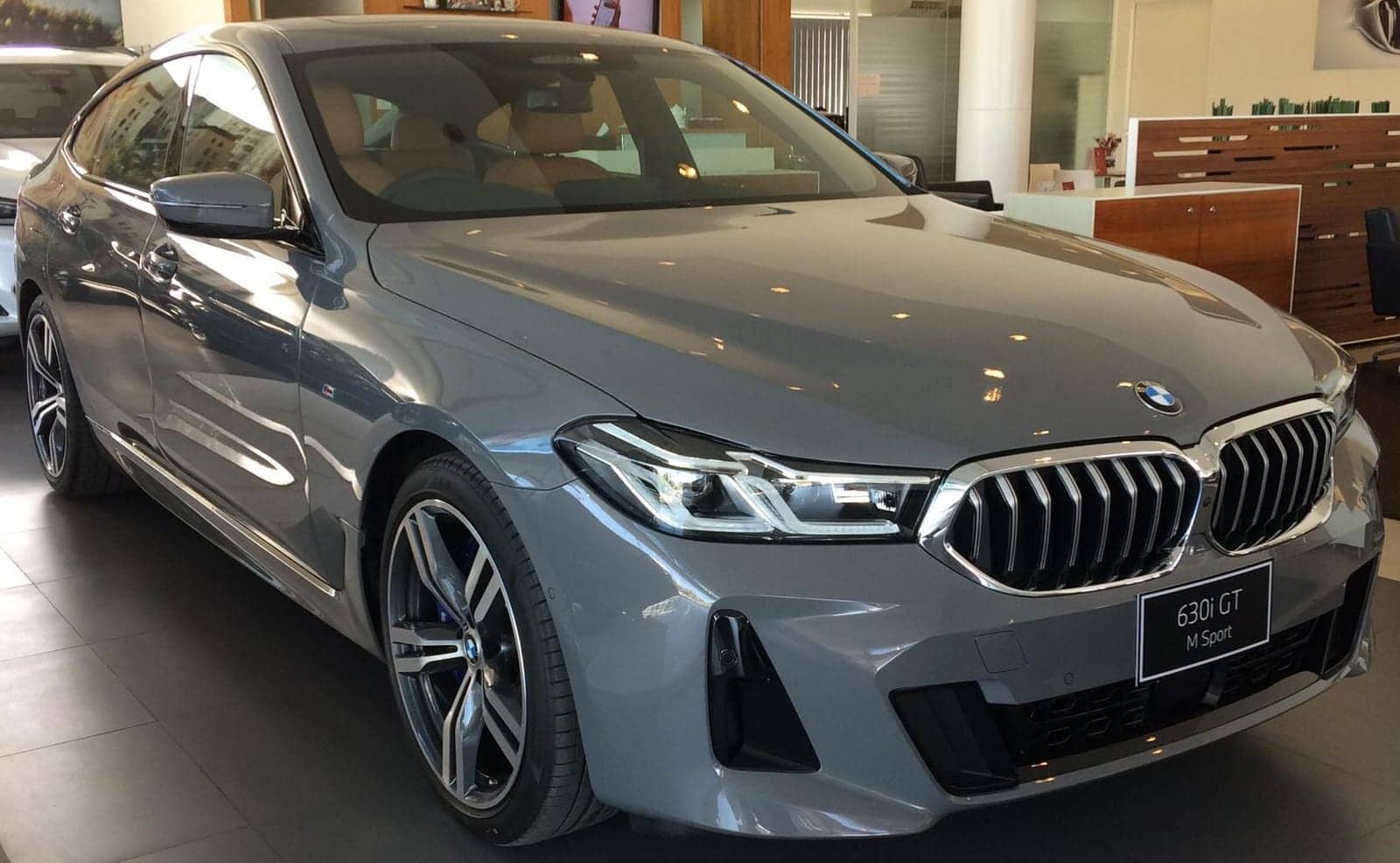 Grey BMW 630i Gran Turismo M Sport (facelift) in a showroom, front three-quarter view