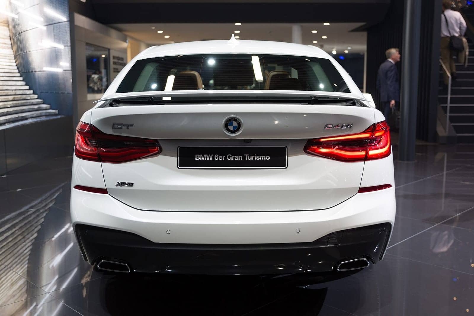 White BMW 640i Gran Turismo at a motor show, rear view