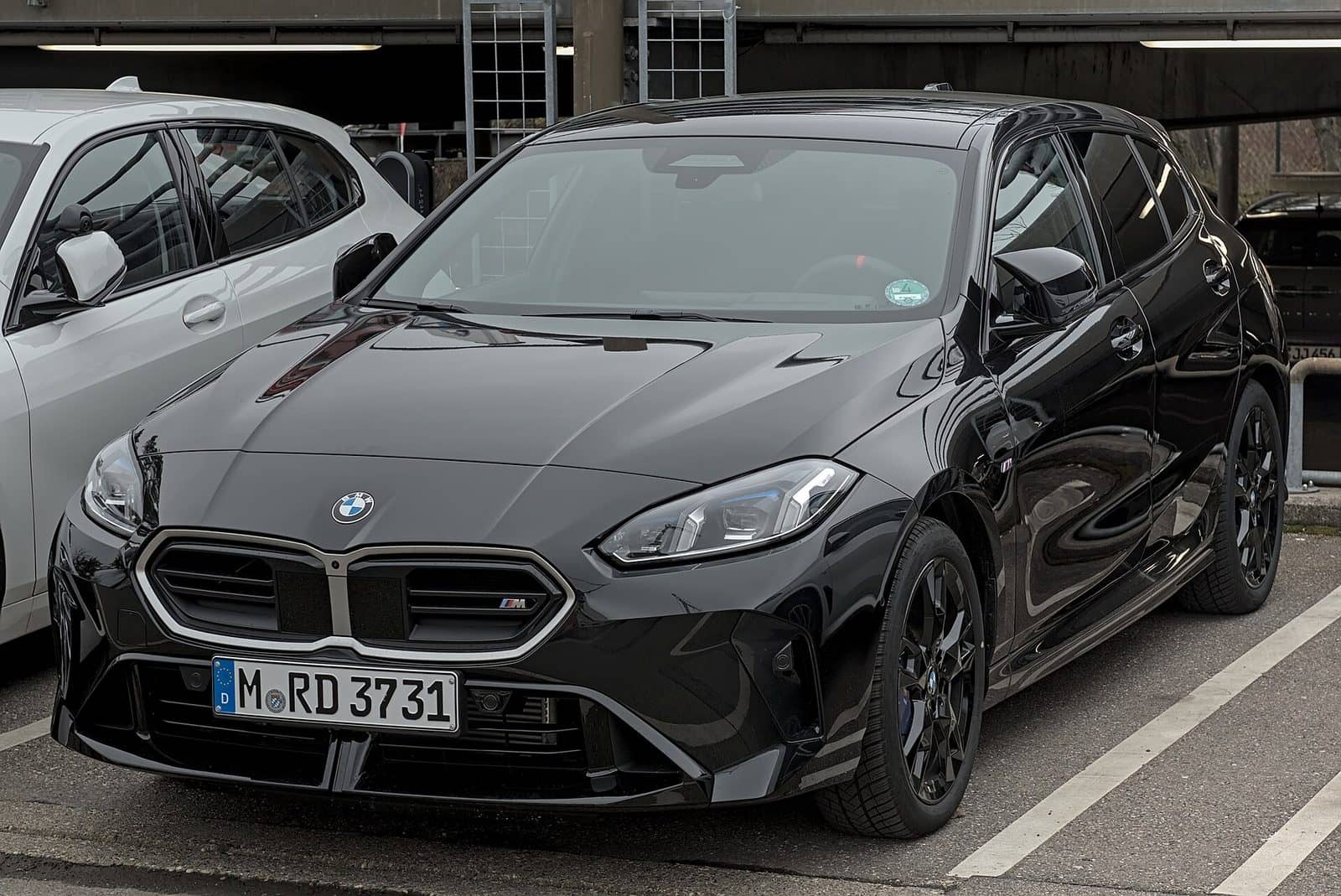 Black BMW M135 xDrive, front three-quarter view