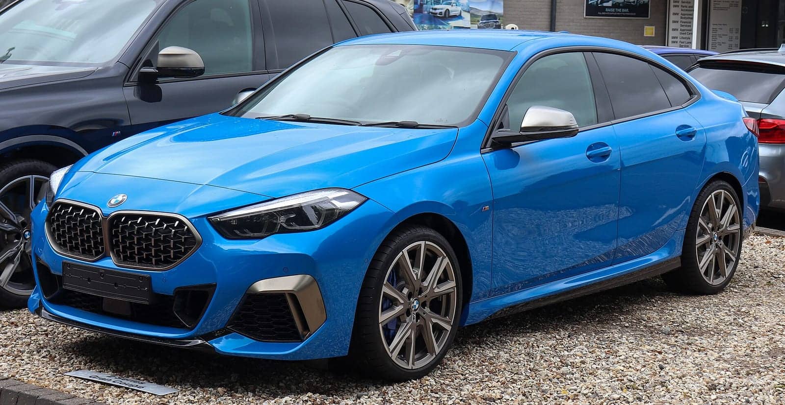 Blue BMW M235i xDrive Gran Coupé, front three-quarter view