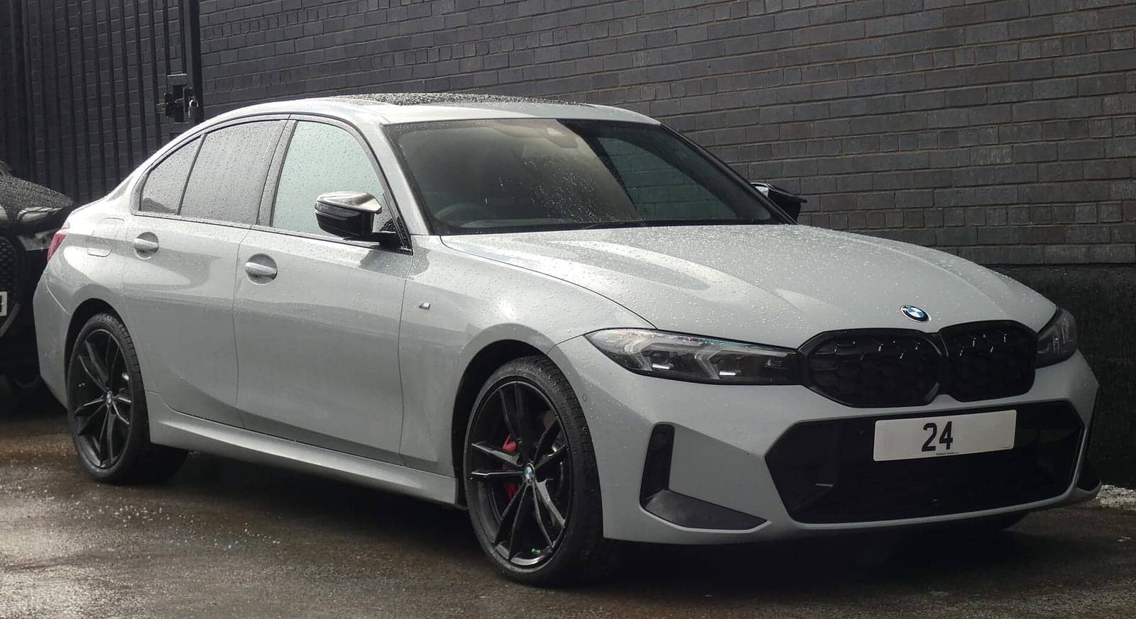 Grey BMW M340i xDrive sedan, front three-quarter view