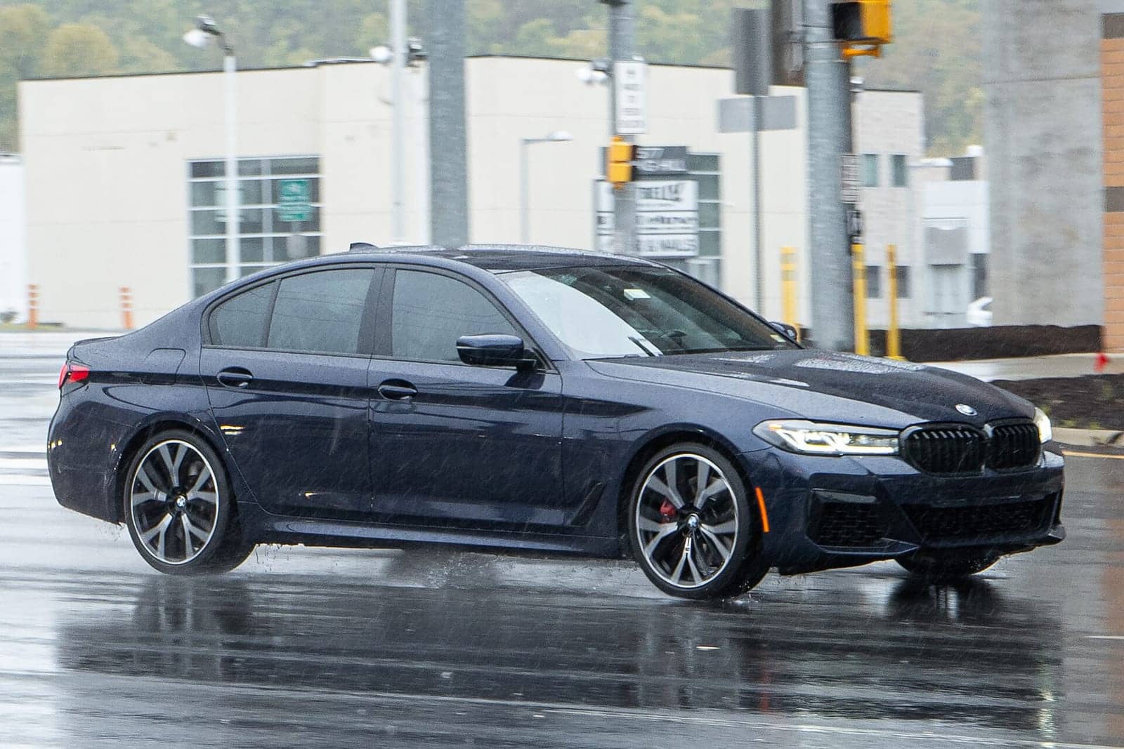 Dark blue BMW 540i (facelift), front three-quarter view