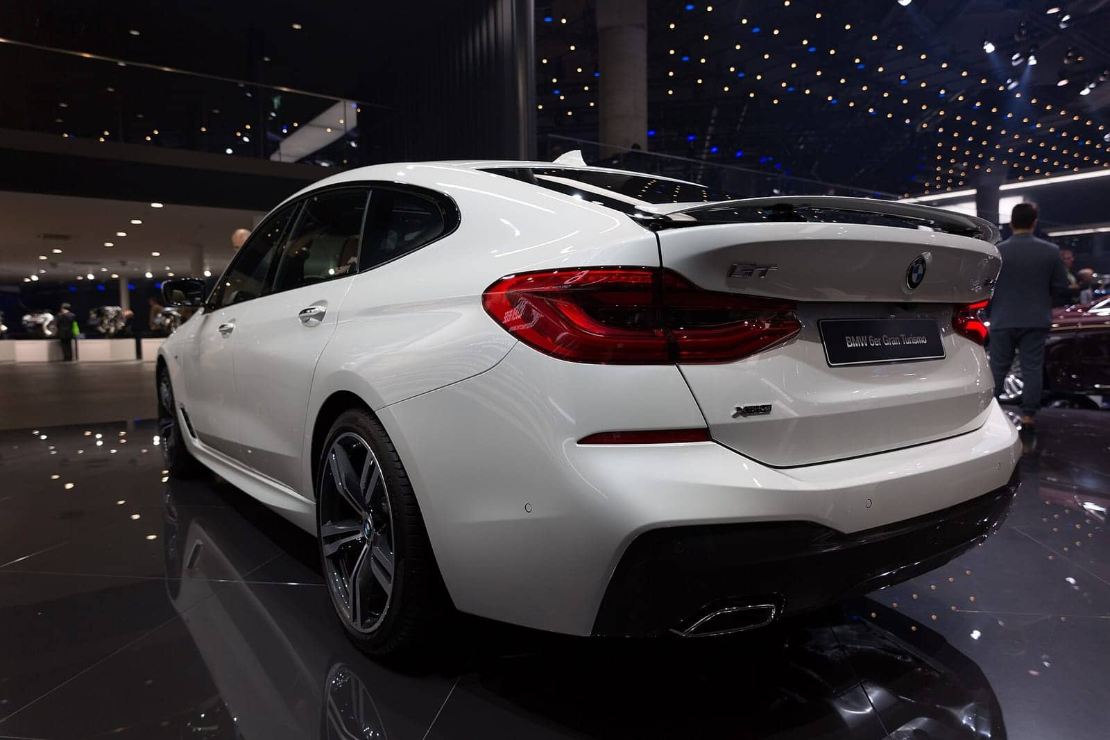 White BMW 640i Gran Turismo at a motor show, rear three-quarter view