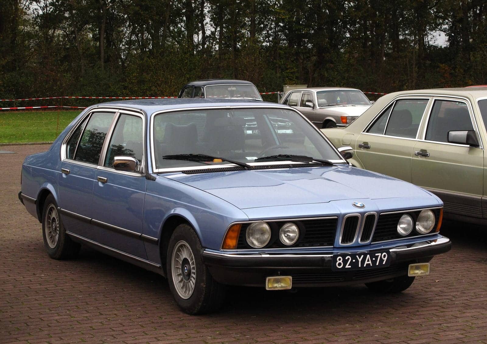 Light blue BMW 733i, front three-quarter view
