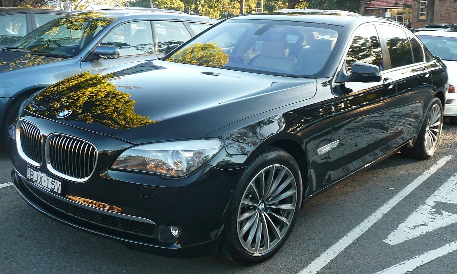 Black BMW 740i, front three-quarter view