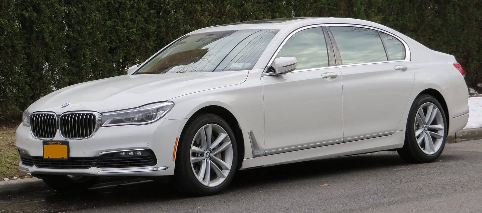White BMW 750i, front three-quarter view
